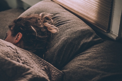 World Sleep Day stock image of woman sleeping 